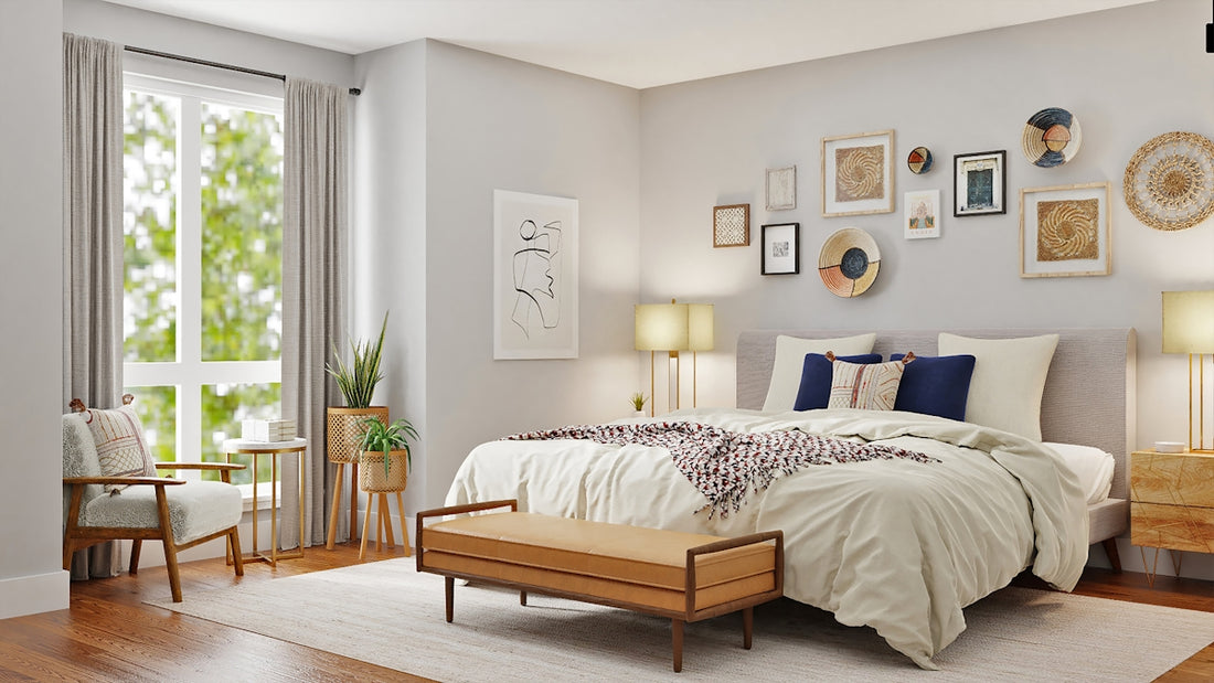 A bedroom with a bed, a leather bench, and wall art in a sunlit room