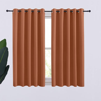 NICETOWN Thermal Insulated Burnt Orange Curtains Blackout Draperies, Window Treatment Solid Grommet Room Darkening Drape Panels for Bedroom (Set of 2, 70 by 54 inches Long)
