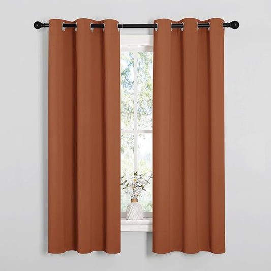 NICETOWN Blackout Curtain Panels for Girls Room, Nursery Essential Thermal Insulated Solid Grommet Top Blackout Drapes (Burnt Orange, 1 Pair, 34 x 63 Inch)