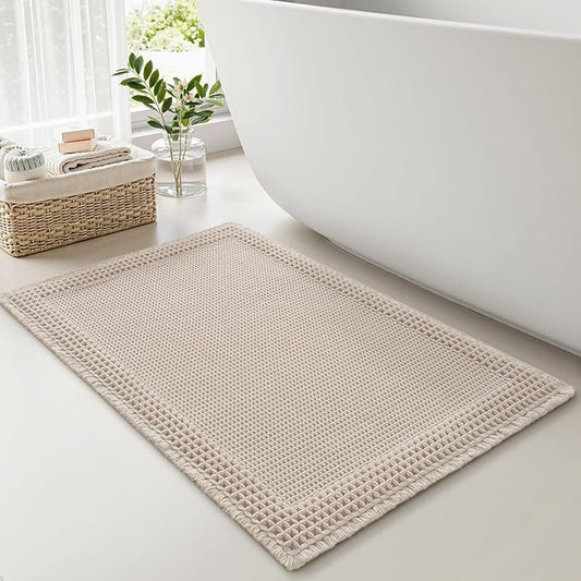 RESARE Waffle Bath Mat for Bathroom, Super Absorbent Bathroom Rugs Non Slip Machine Washable, Ultra Soft Quick Dry Boho Bath Rugs with Tassels for Floor, Upgraded Bordered Design, 18"x30" Pale Beige