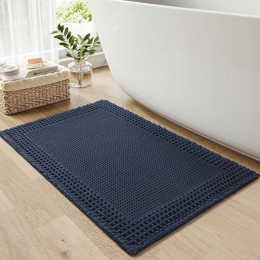 RESARE Waffle Bath Mat for Bathroom, Super Absorbent Bathroom Rugs Non Slip Machine Washable, Ultra Soft Quick Dry Boho Bath Rugs with Tassels for Floor, Upgraded Bordered Design, 24"x36" Navy